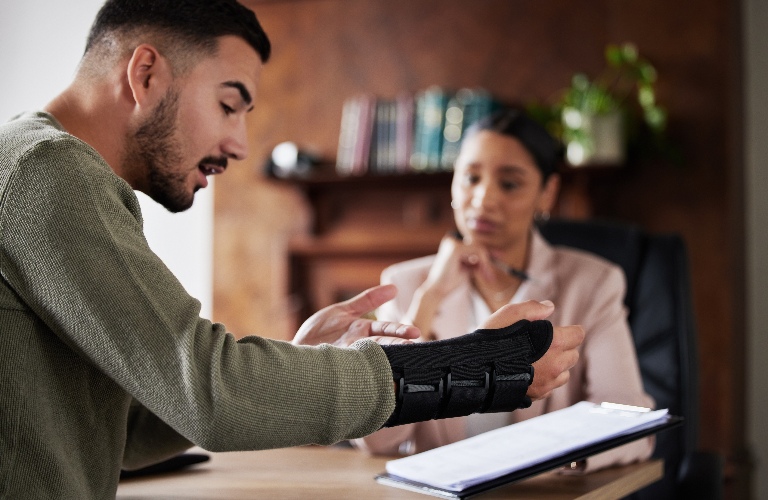 Injured man is consulting with lawyer